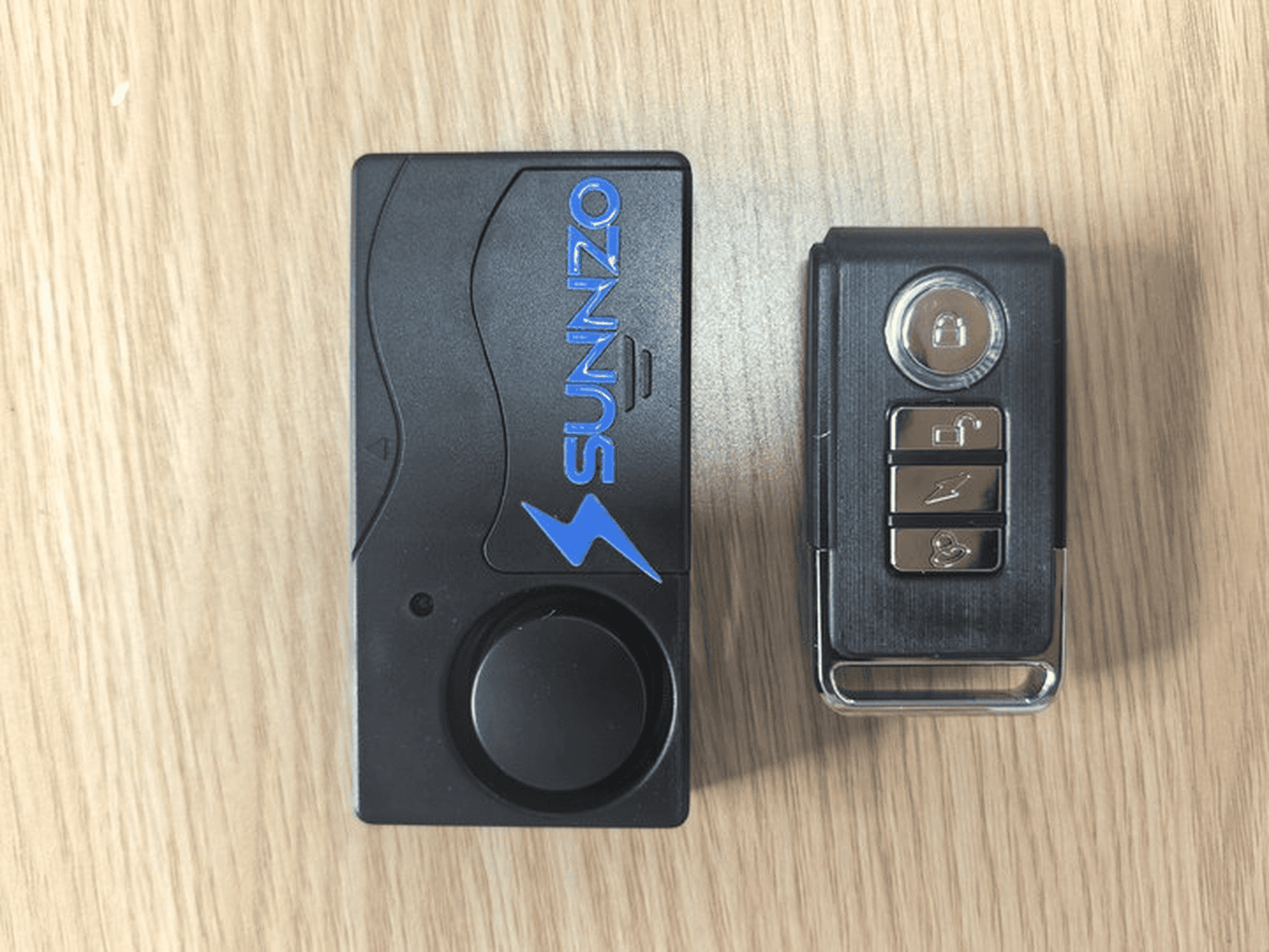SUNNZO Parts for anti-theft automotive alarms, namely, electronic sensors, remote control transmitters and receivers for remotely operating land vehicles